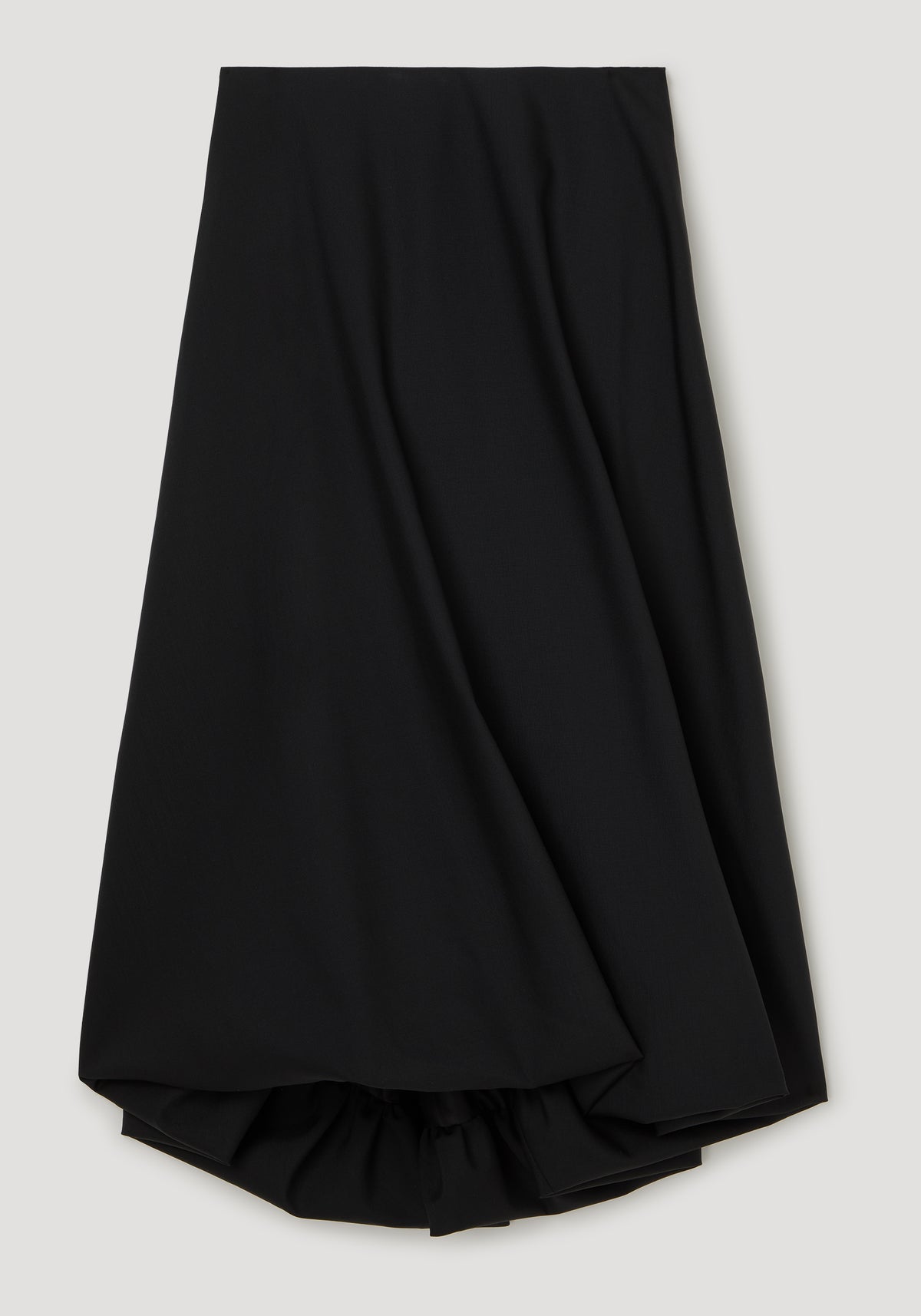 Twisted skirt | black shown as a flowing black skirt with a twisted draped detail and gathered hem on a light background