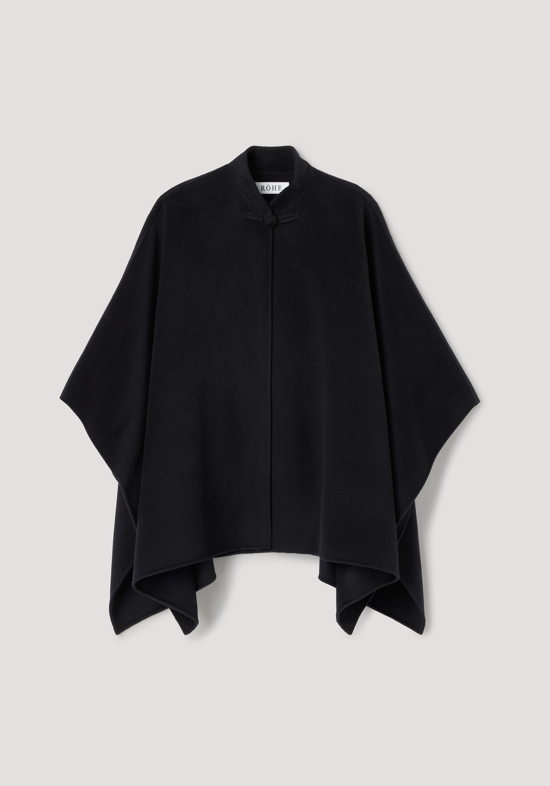 Double-faced pankou poncho | black displayed flat with a minimalist design, featuring a simple fastening at the neck and wide draped silhouette.