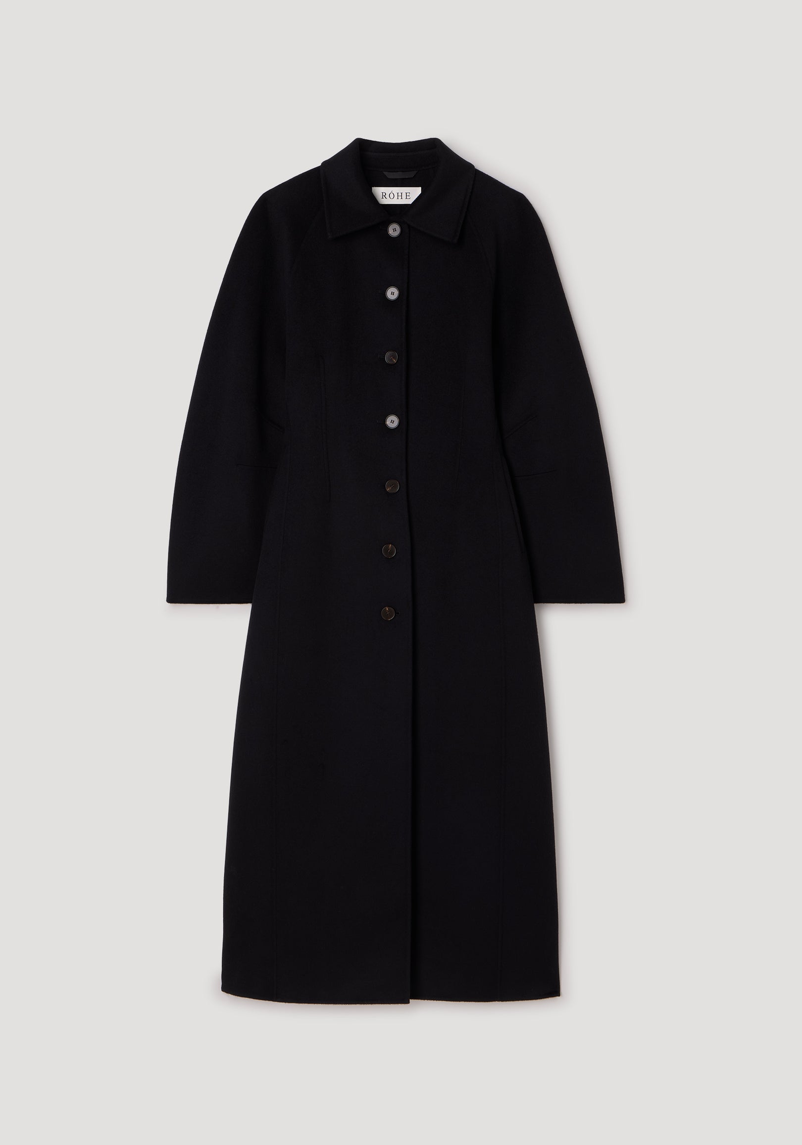 Double-faced elongated sculptural coat | black with long sleeves, a collar, and a front button closure, displayed against a plain light background.