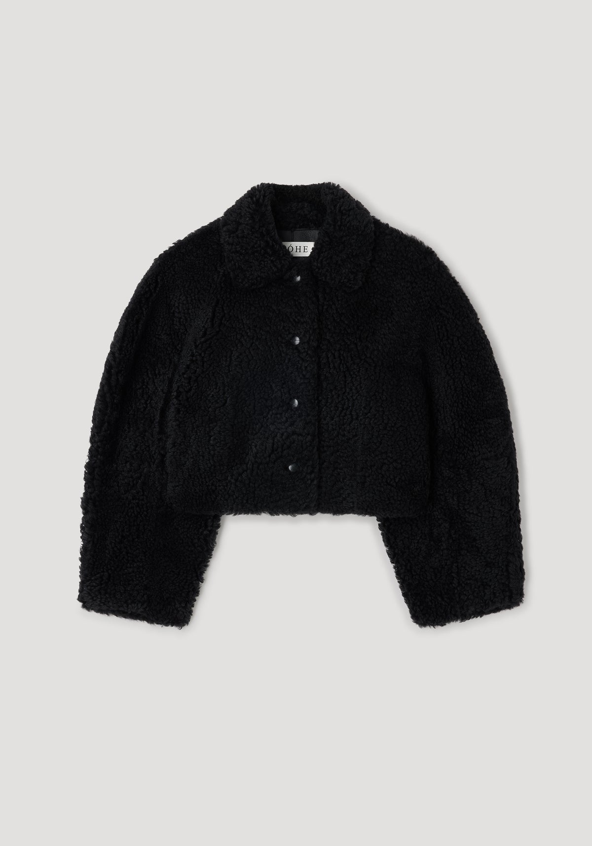 Rounded shearling jacket | black with a soft, textured finish, featuring a classic collar and button-down front for a cozy and stylish outerwear option.