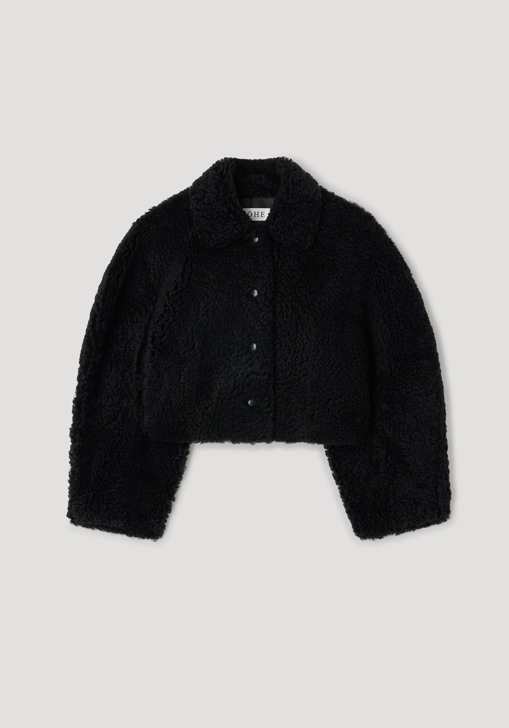 Rounded shearling jacket | black with a soft, textured finish, featuring a classic collar and button-down front for a cozy and stylish outerwear option.