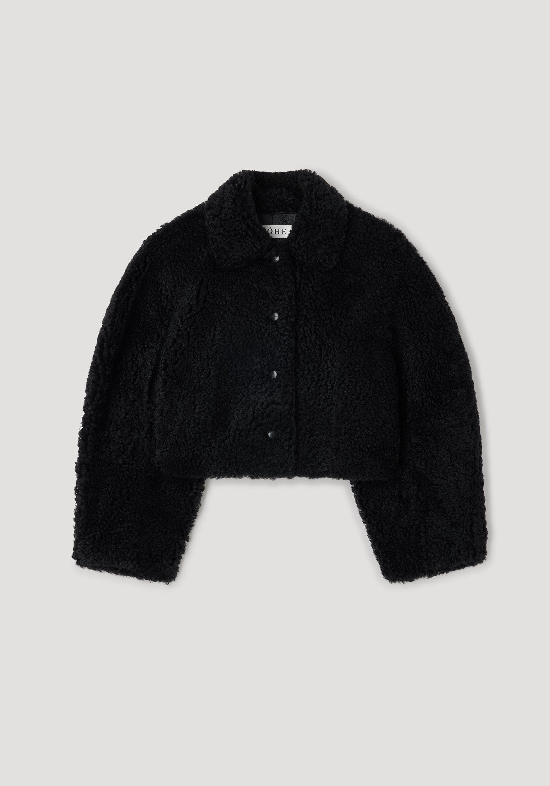 Rounded shearling jacket | black with a soft, textured finish, featuring a classic collar and button-down front for a cozy and stylish outerwear option.