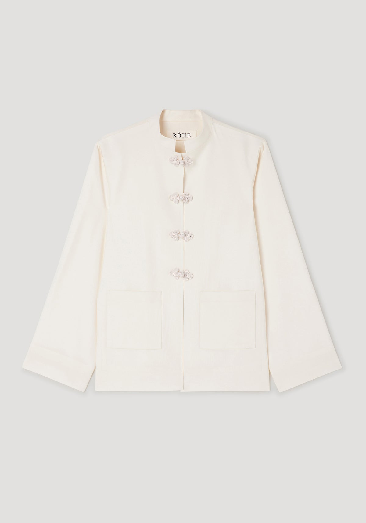 Pankou closure jacket | off white with a stand collar, long sleeves, front patch pockets, and traditional pankou knot buttons down the center.