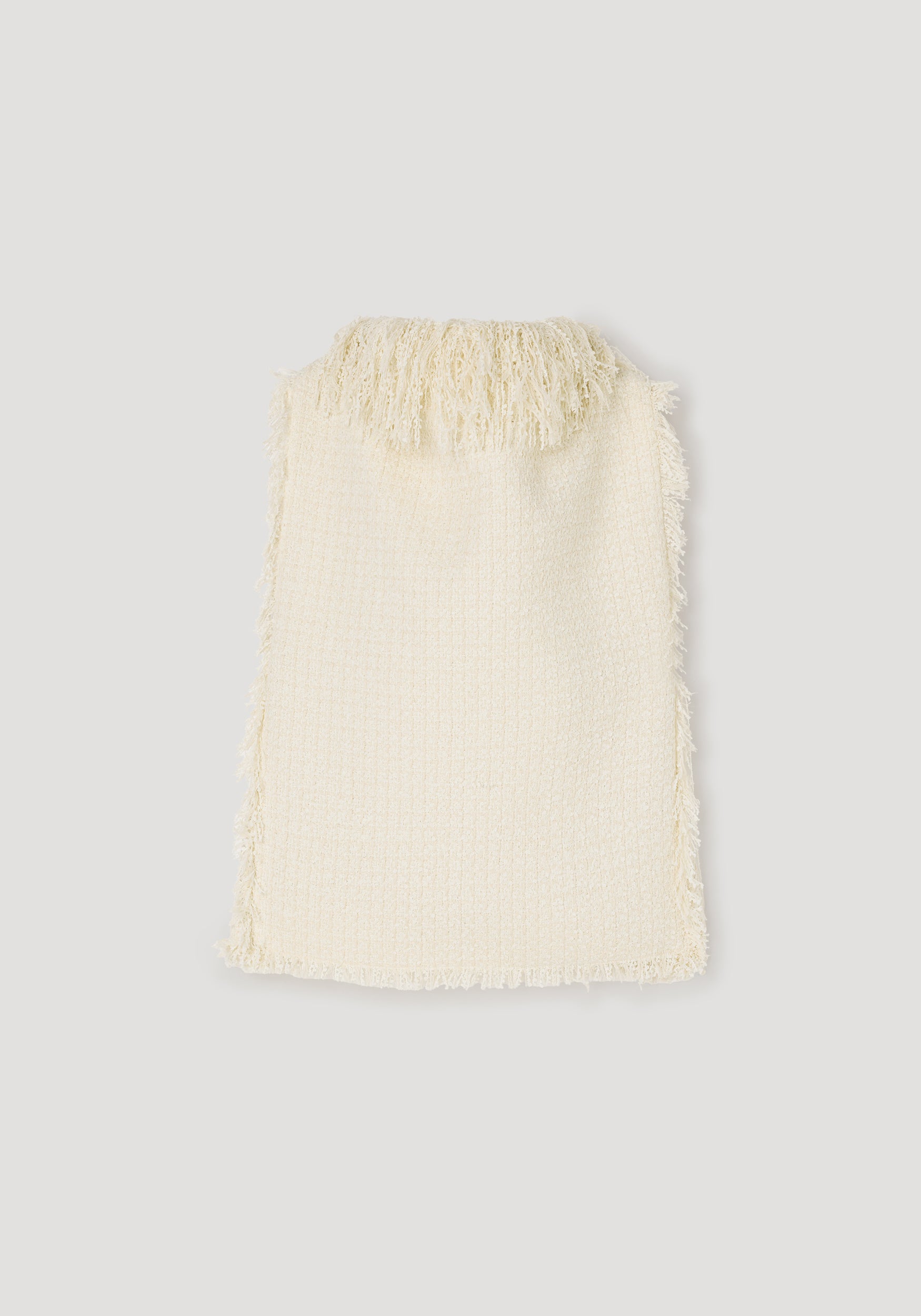 Cream textured fringe bouclé top | cream with soft fringed detailing along the neckline and edges, showcasing a cozy and stylish woven fabric design.