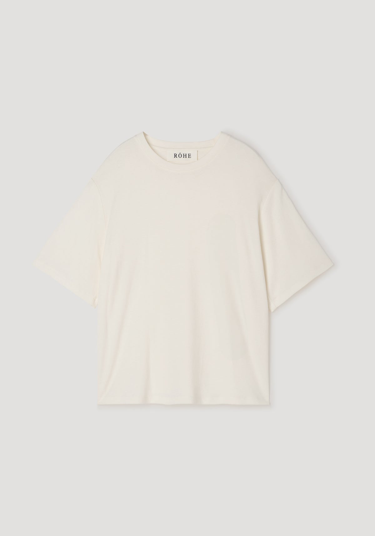 Oversized cotton wool t-shirt | cream in a soft, relaxed fit with short sleeves and a round neckline, displayed flat on a neutral background.