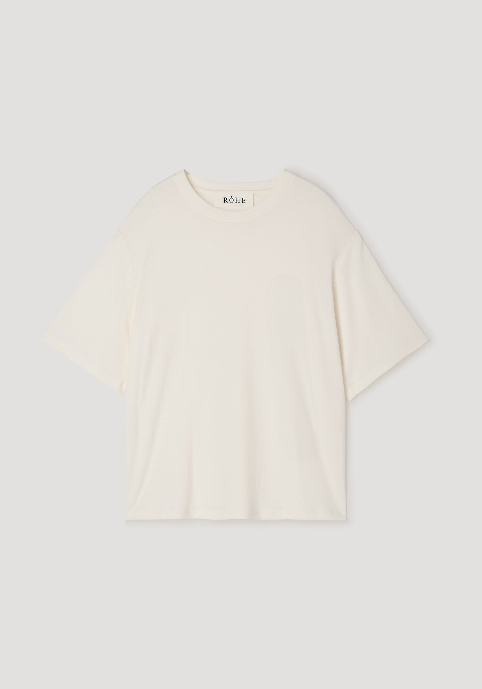 Oversized cotton wool t-shirt | cream in a soft, relaxed fit with short sleeves and a round neckline, displayed flat on a neutral background.