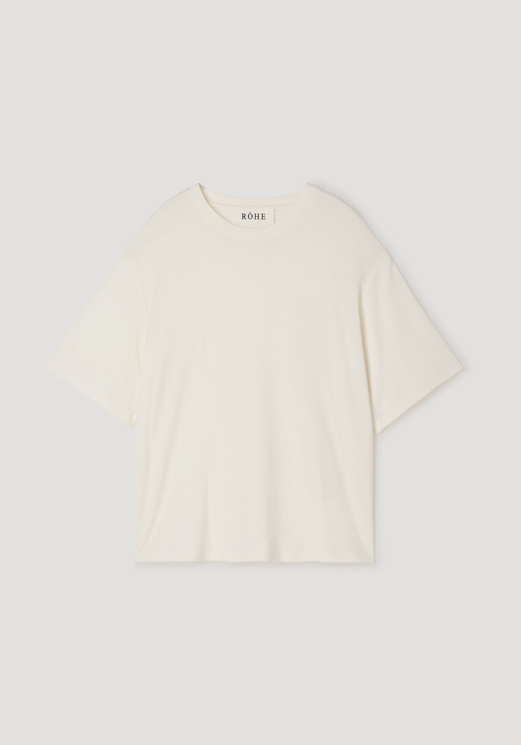 Oversized cotton wool t-shirt | cream in a soft, relaxed fit with short sleeves and a round neckline, displayed flat on a neutral background.