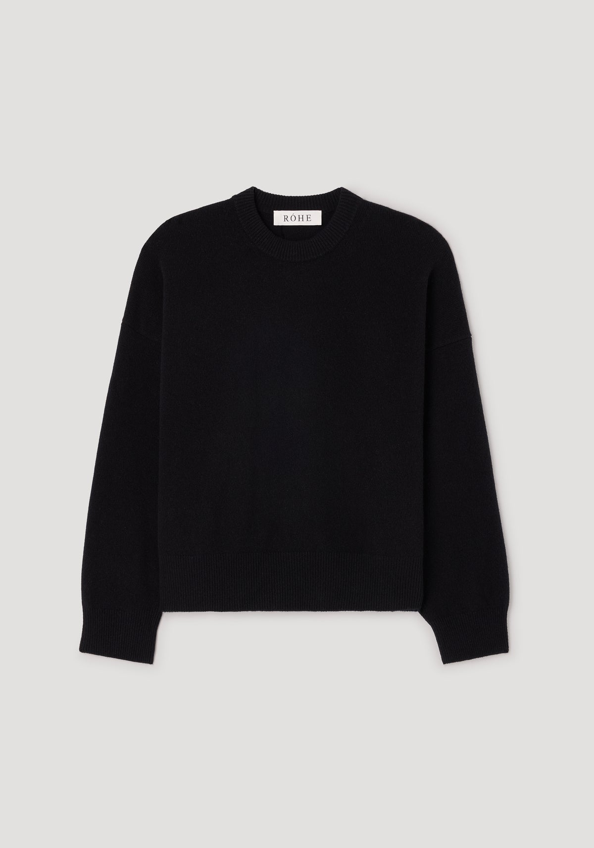 Classic crewneck jumper | black displayed on a plain background, featuring long sleeves and a ribbed neckline, cuffs, and hem for a simple yet timeless look.