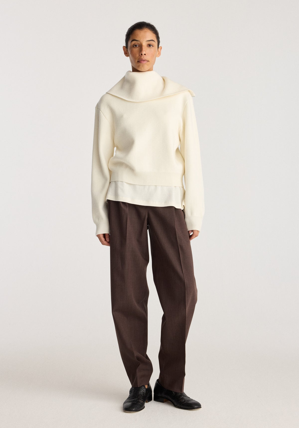 Reversible sailor zip cardigan | cream worn by a model with a wide sailor collar and relaxed fit styled with dark brown trousers and black shoes