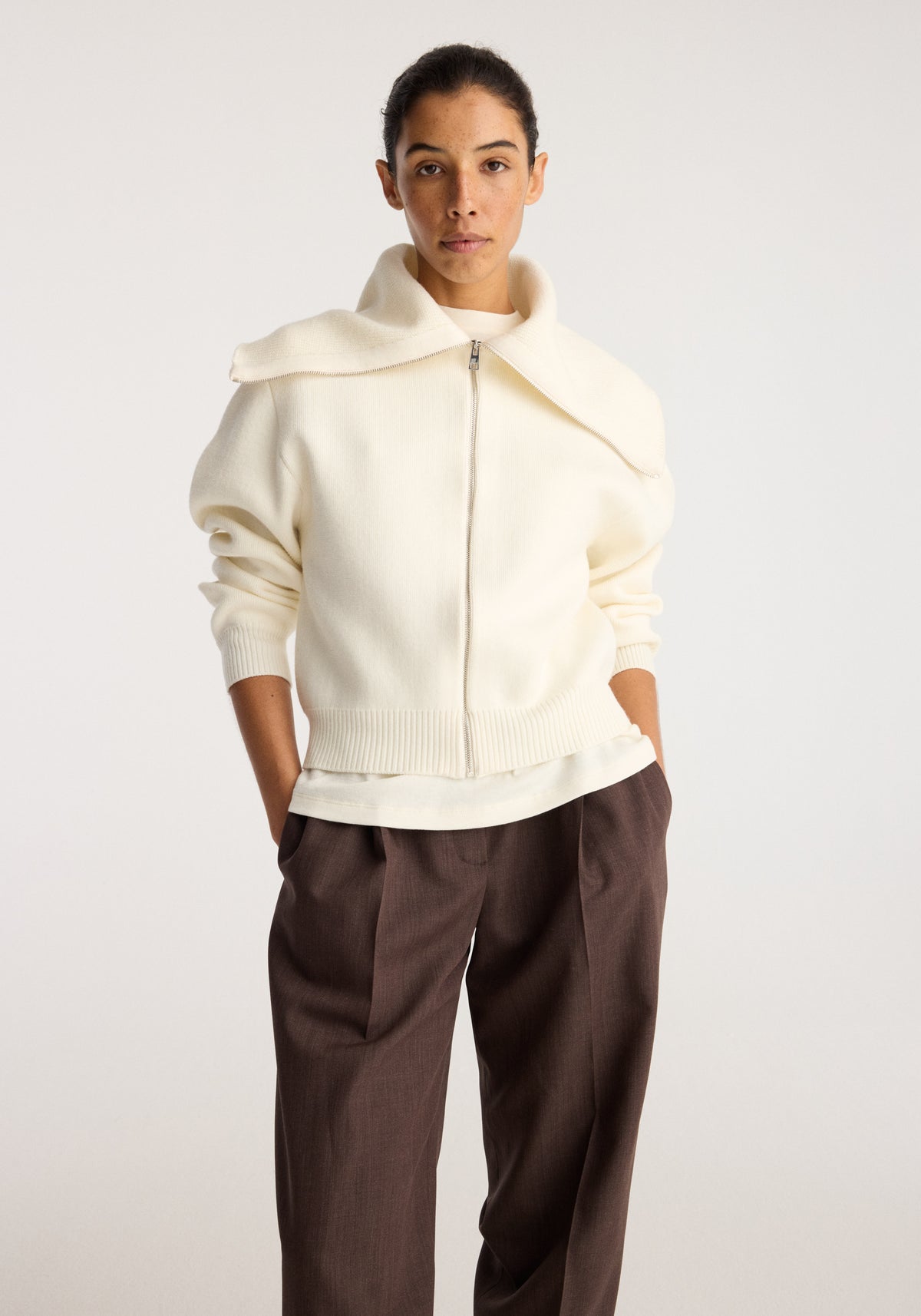 Reversible sailor zip cardigan | cream worn by a model with an oversized sailor collar front zip closure and ribbed cuffs