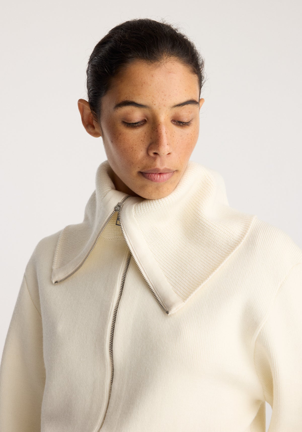 Reversible sailor zip cardigan | cream worn by a model with an oversized sailor collar and front zip in a close up view