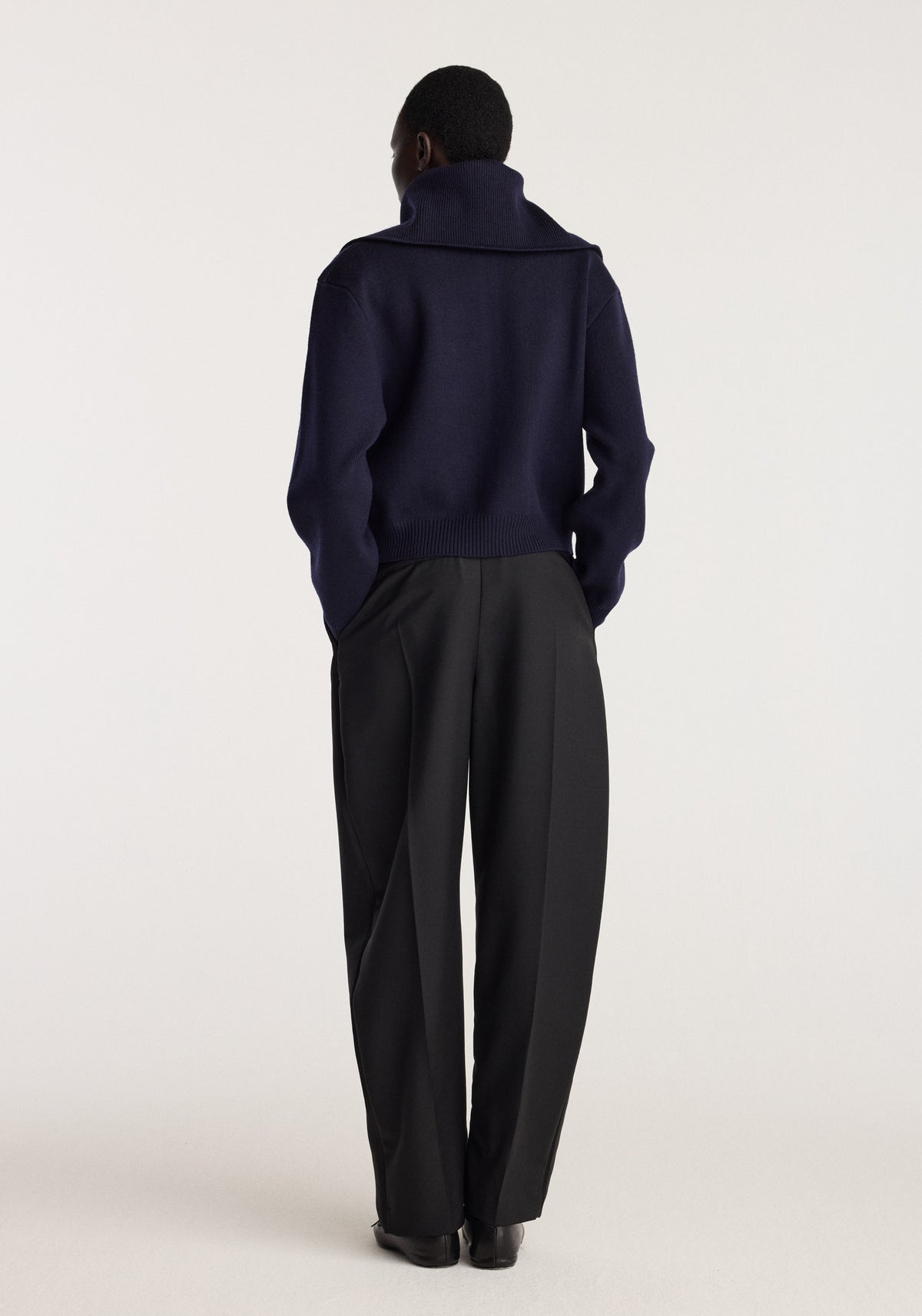 Reversible sailor zip cardigan | navy shown from the back on a model with a high collar and relaxed fit