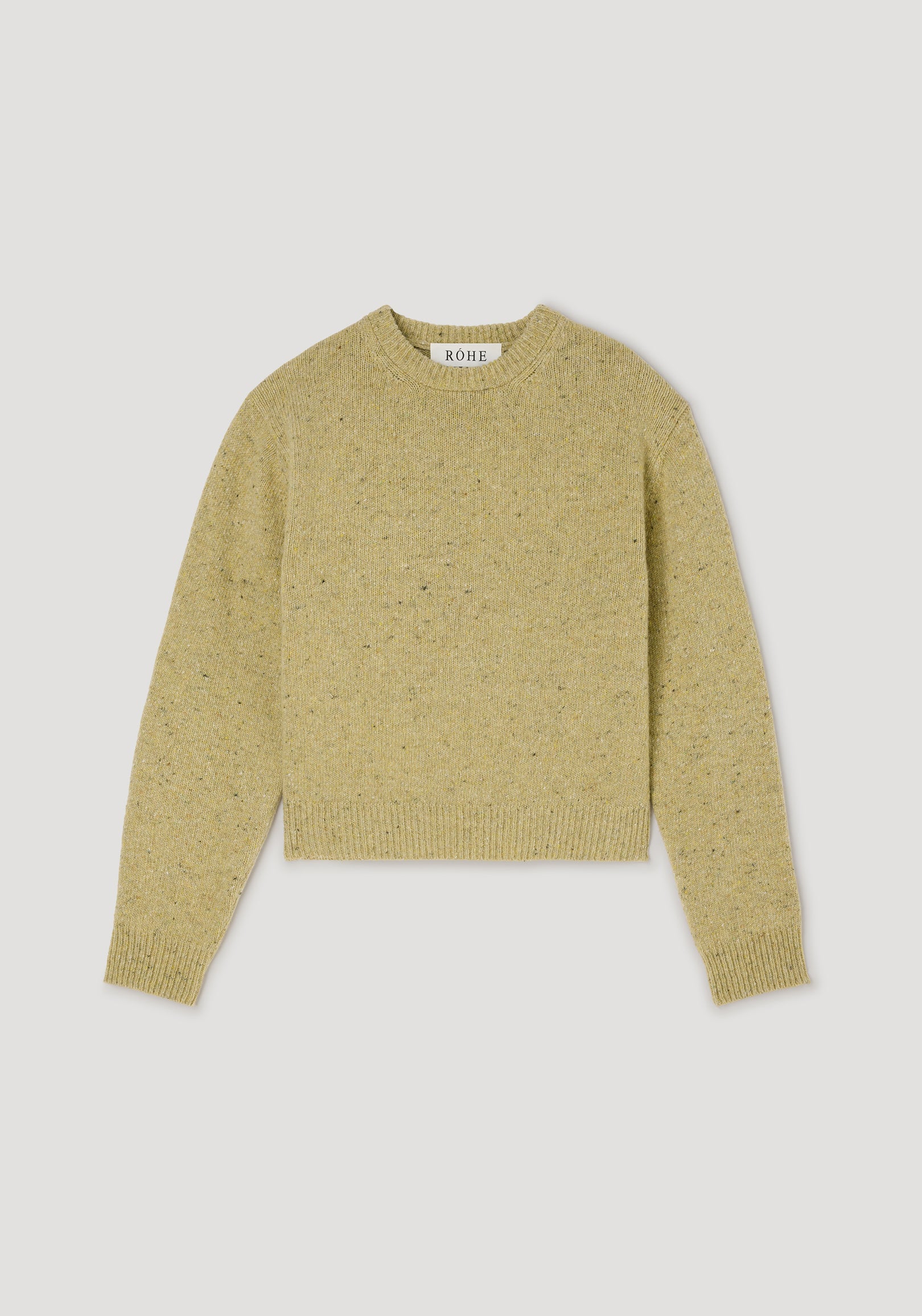 Fitted mouliné crewneck | butter mouliné sweater laid flat on a light gray background, showing its long sleeves and ribbed trim
