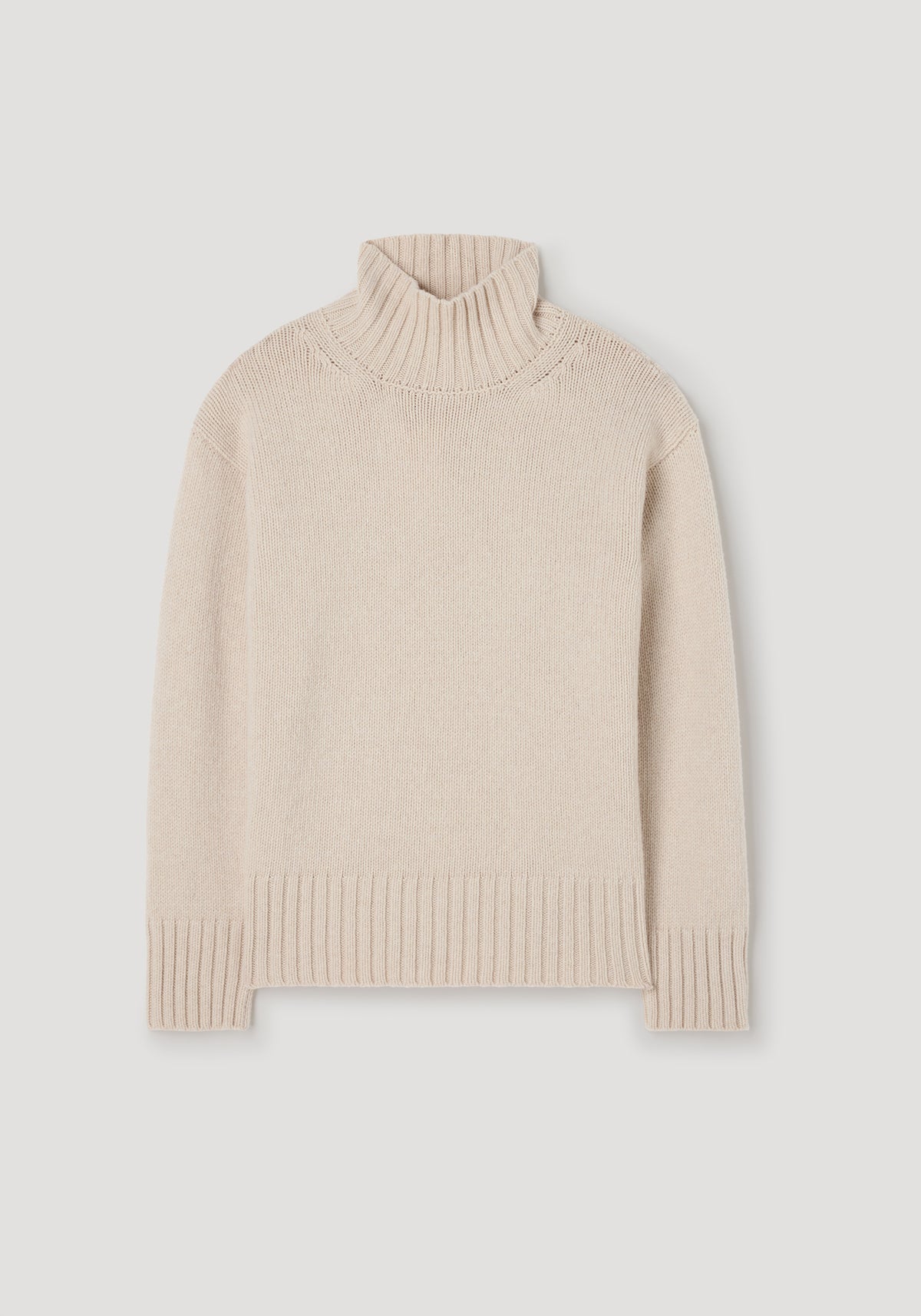 Wool-cashmere turtleneck | oat in a soft beige color, featuring a ribbed high neck, cuffs, and hem, designed for cozy and elegant cold-weather wear.