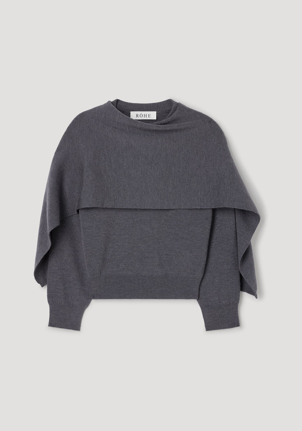Cape jumper | dark grey melange shown flat, featuring a layered knit design with a wide cape-like overlay and ribbed cuffs and hem in a soft, dark grey melange fabric.