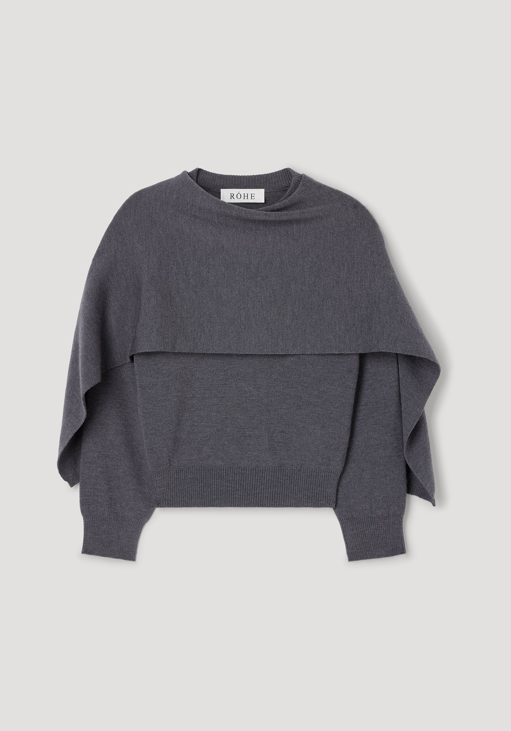 Cape jumper | dark grey melange shown flat, featuring a layered knit design with a wide cape-like overlay and ribbed cuffs and hem in a soft, dark grey melange fabric.