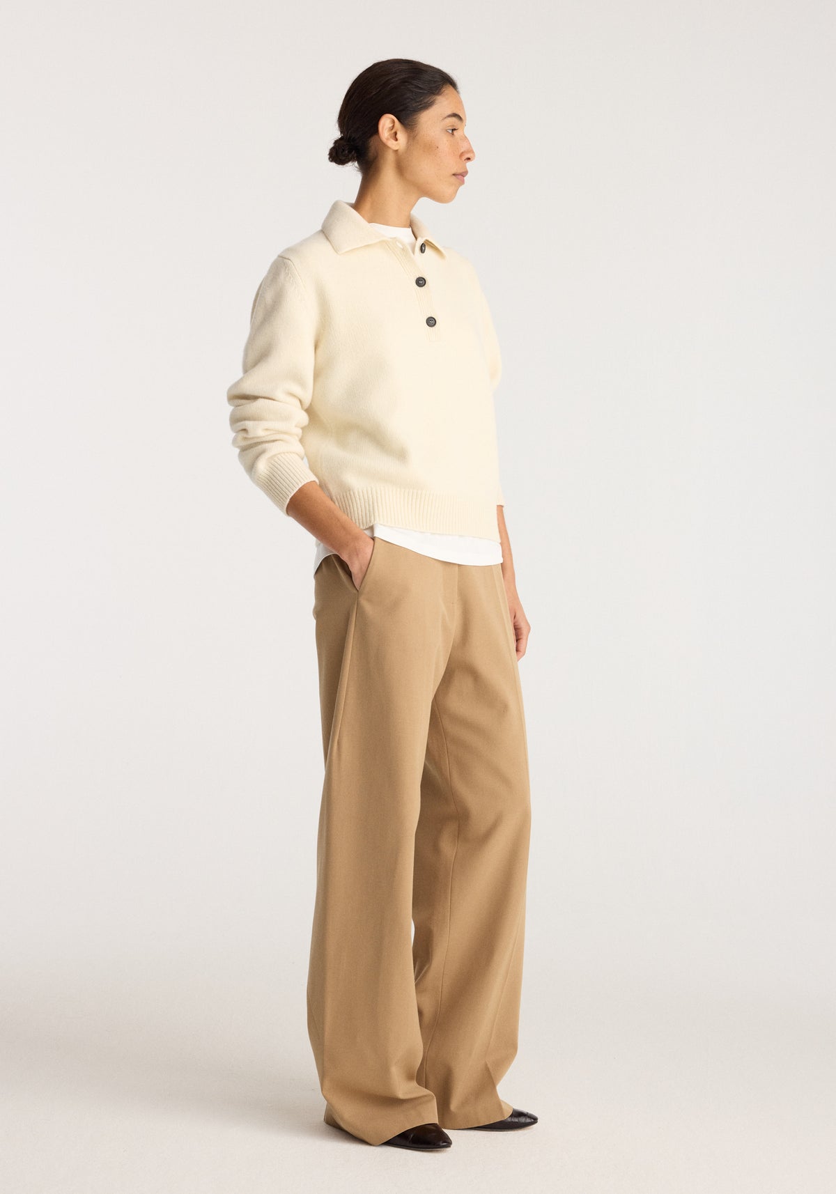 Wool-cashmere polo | cream worn by a model with wide-leg tan trousers in a minimalist studio setting