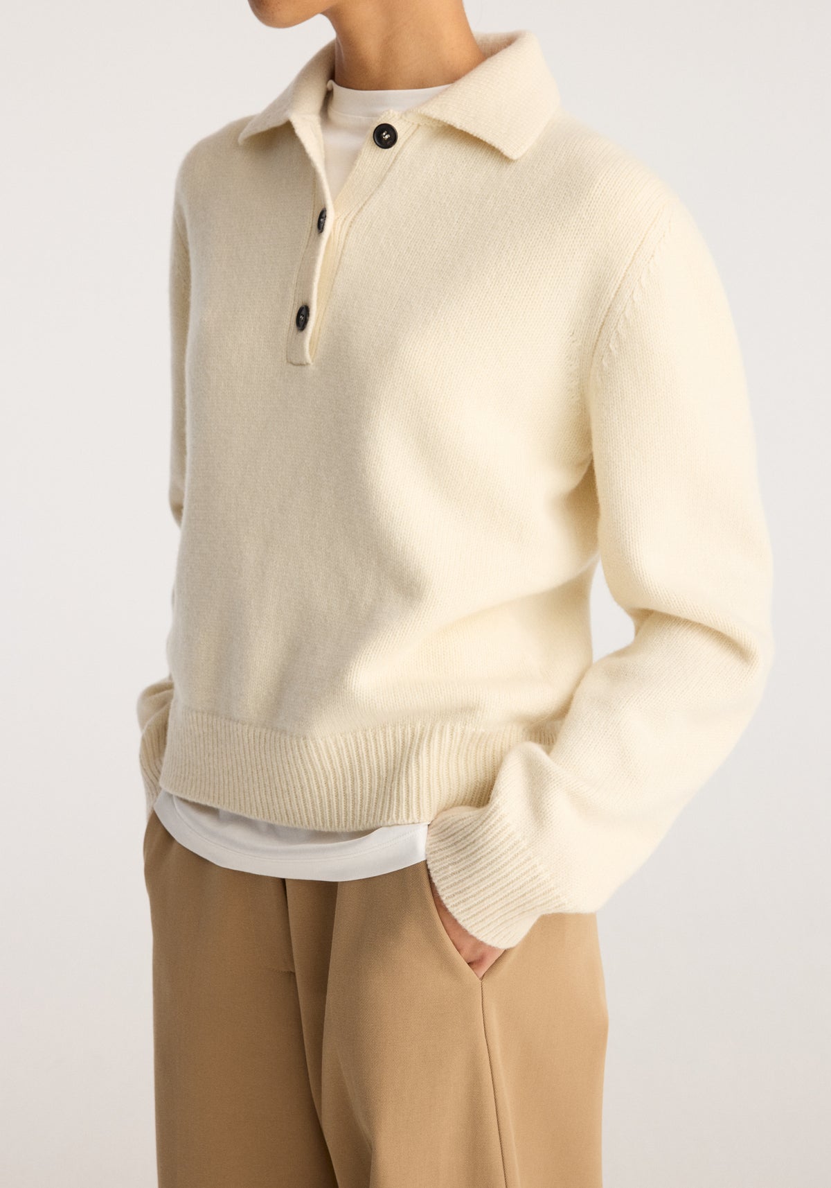 Wool-cashmere polo | cream worn with tan trousers featuring a soft collared neckline button placket ribbed cuffs and hem in a relaxed fit