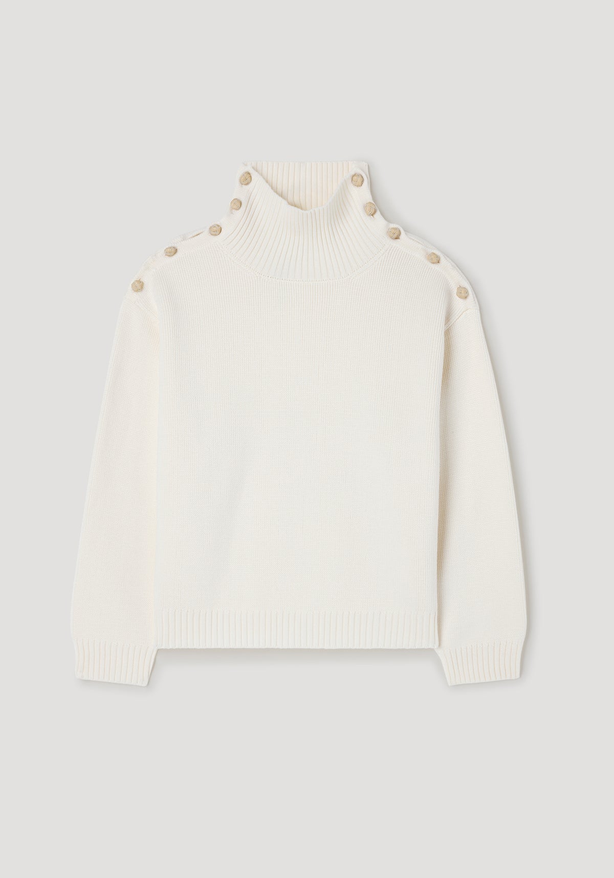Cream-colored knit sweater with high ribbed collar and button details along shoulders and neck, shown flat, featuring the Uneven sailor polo | cream design.