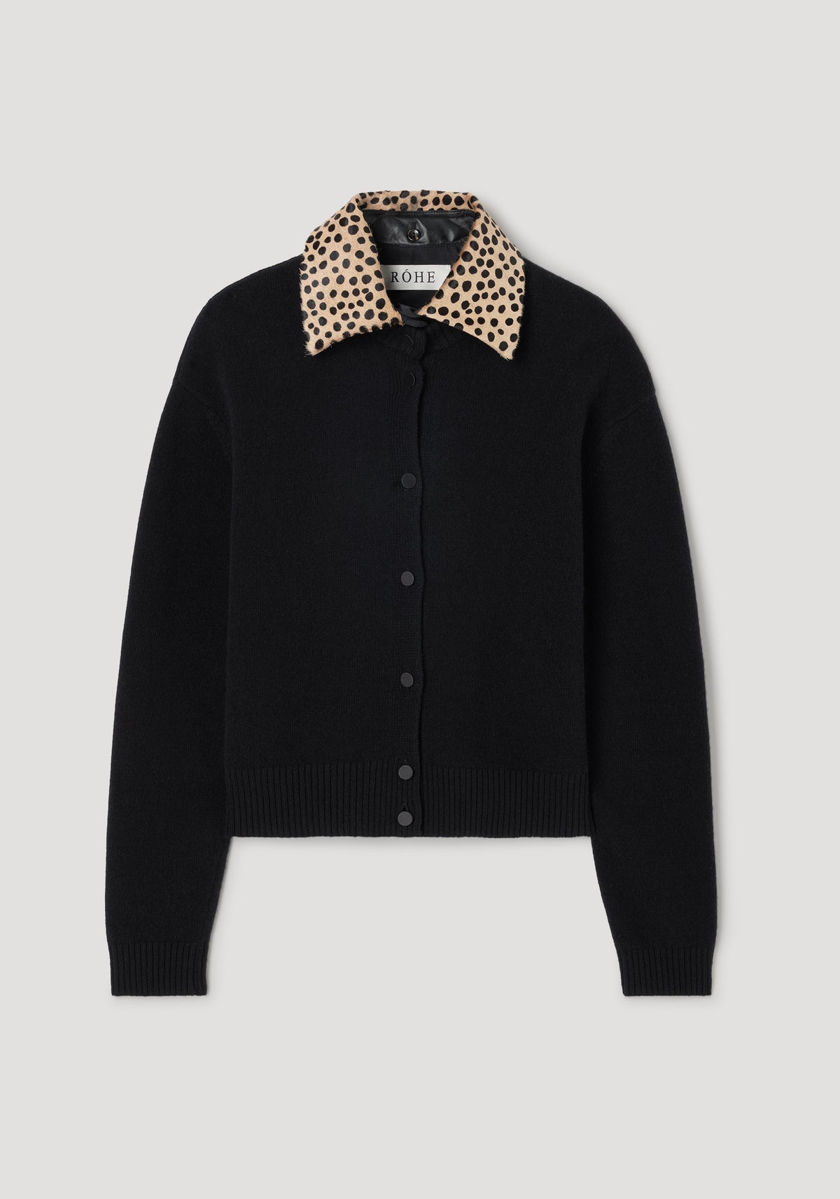 Cheetah collar cardigan | black with a black button-down front and a beige collar featuring black cheetah spots, displayed on a light gray background.