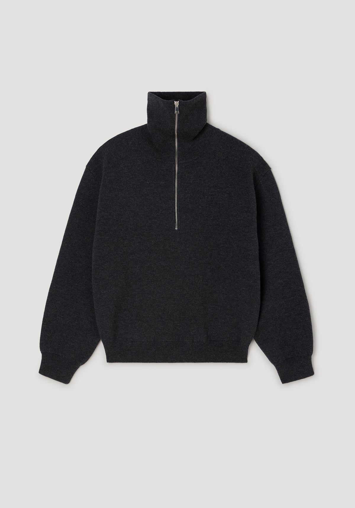 Two-way zipped turtleneck | charcoal in dark gray color with a high collar and long sleeves, featuring a silver zipper running halfway down the front.