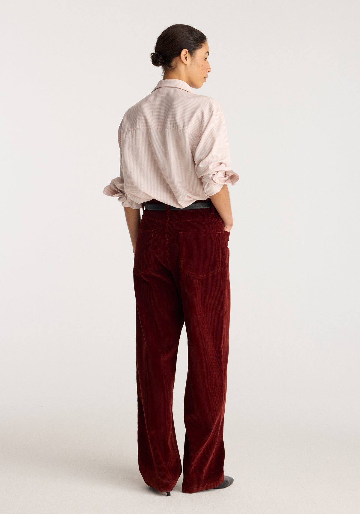 Bruun - Signature baggy corduroy trousers | wine shown from the back on a model with a relaxed fit and wide legs