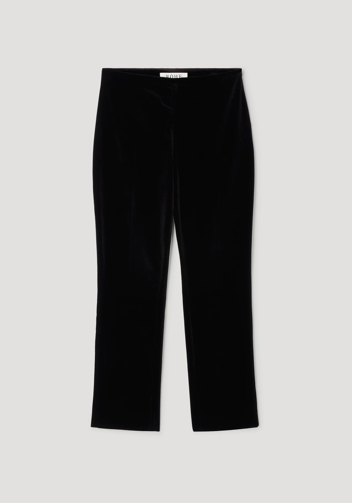Black velvet cigarette leg tailored trousers laid flat, featuring a sleek and fitted silhouette with a smooth texture, labeled as Cigarette leg velvet tailored trousers | black.
