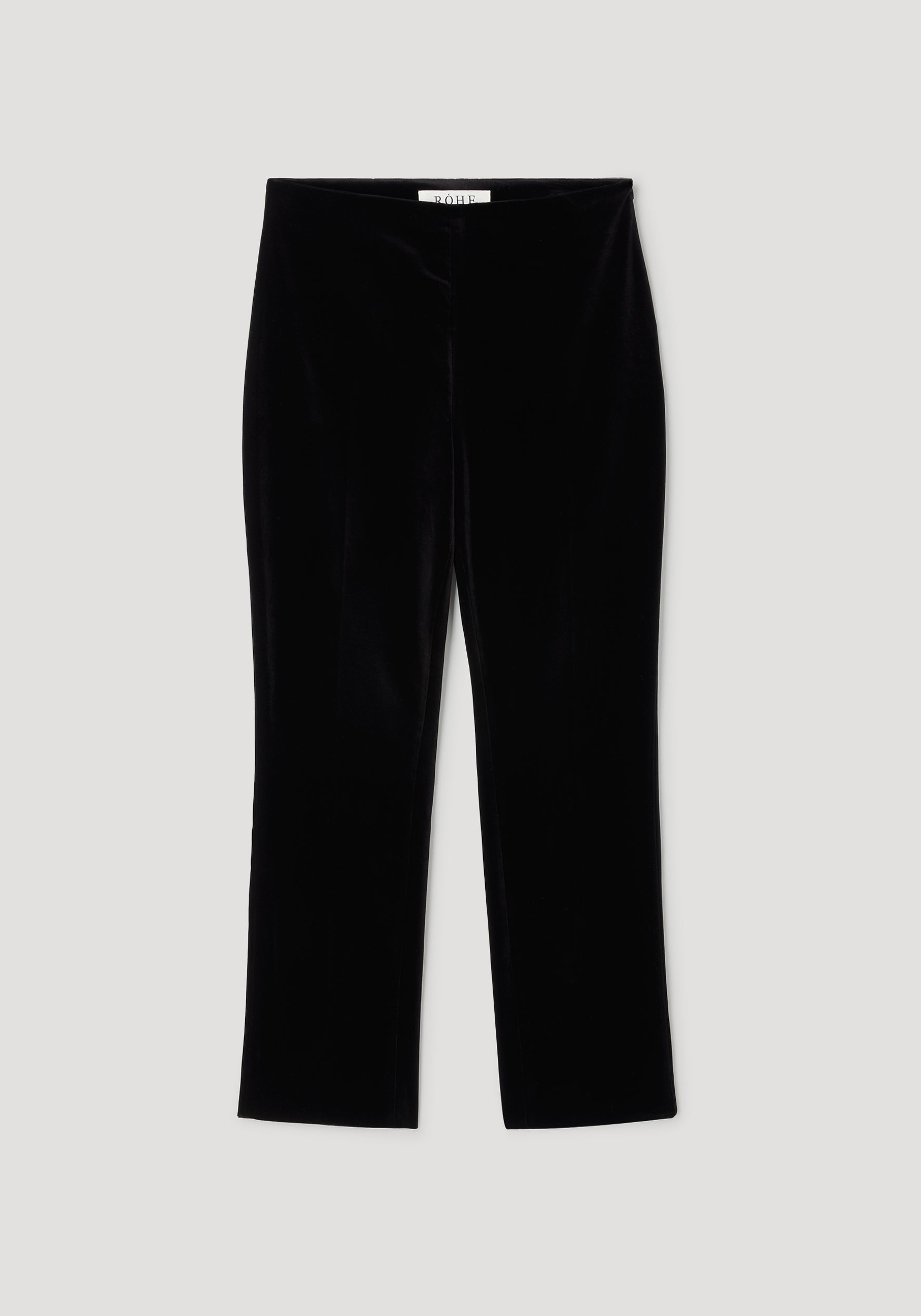 Black velvet cigarette leg tailored trousers laid flat, featuring a sleek and fitted silhouette with a smooth texture, labeled as Cigarette leg velvet tailored trousers | black.