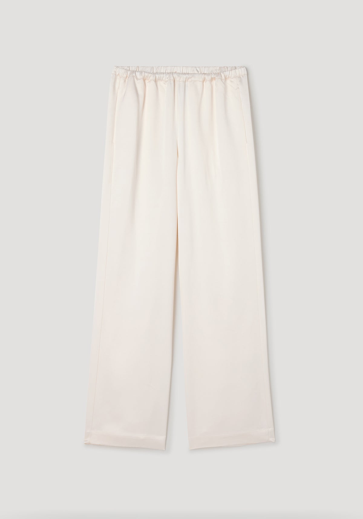 Relaxed fit satin trousers | cream in a soft, smooth fabric with an elastic waistband and straight leg design, styled for comfortable and elegant wear.