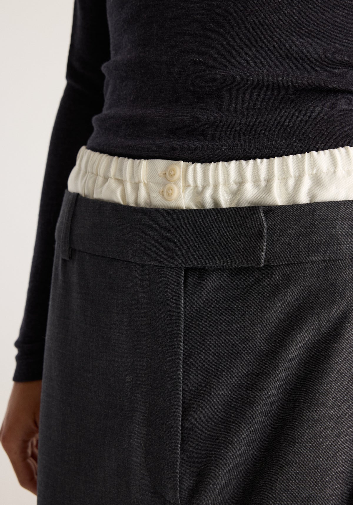 Boxer detailed skirt | dark grey melange, close-up showing the structured front pocket and contrasting white elastic boxer waistband with button detail