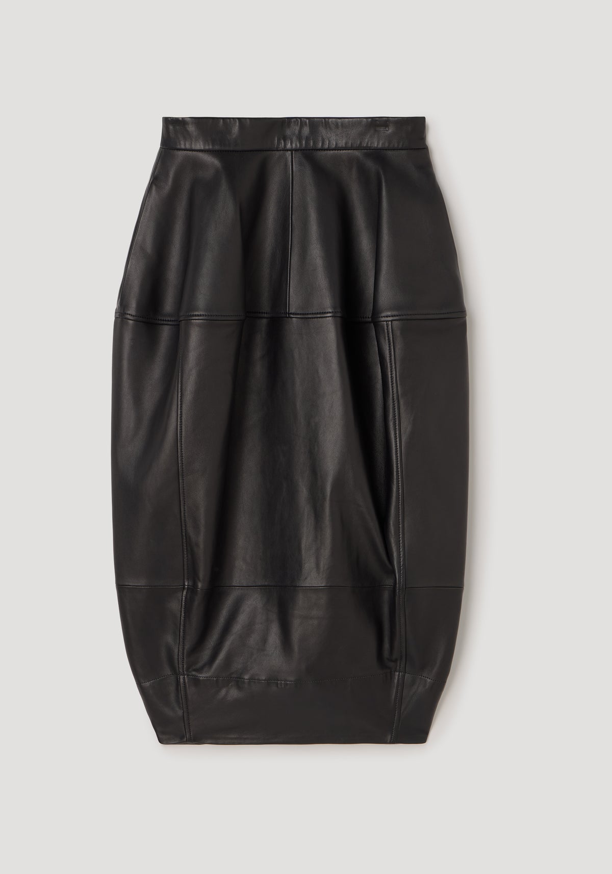 Sleek sculptural leather skirt | black with panel detailing and a fitted silhouette, designed for a modern and edgy look.