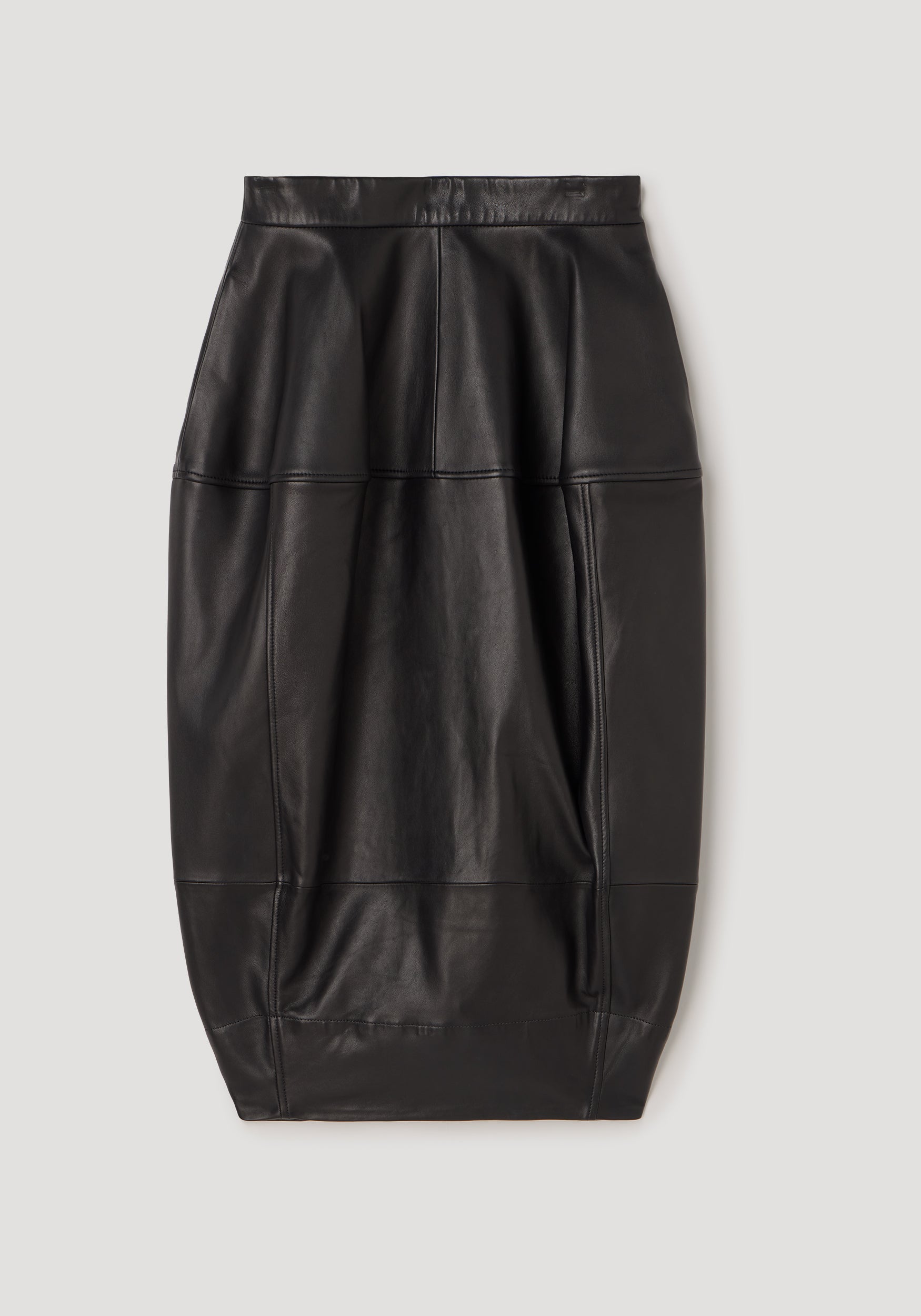 Sleek sculptural leather skirt | black with panel detailing and a fitted silhouette, designed for a modern and edgy look.