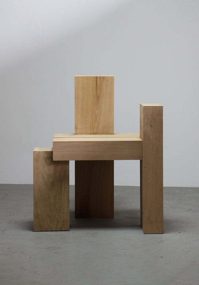 Cubistic Chair | 7365: Geometric stool crafted from chunky oak blocks, featuring four vertical posts and a horizontal seat, showcasing Arne Kristian's cubistic design approach.