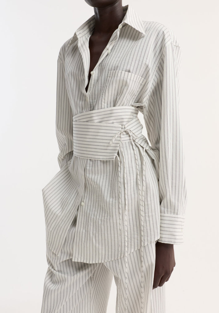 Silk stripe belted shirt with wide sleeves, featuring a corset-style wrap belt. Made from striped silk-cotton fabric, styled with matching loose trousers.