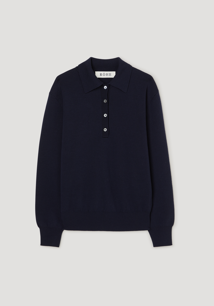 Merino wool polo in navy features a long-sleeve, compact knit with a structured collar and three-button placket, crafted from 100% merino wool for a relaxed fit.