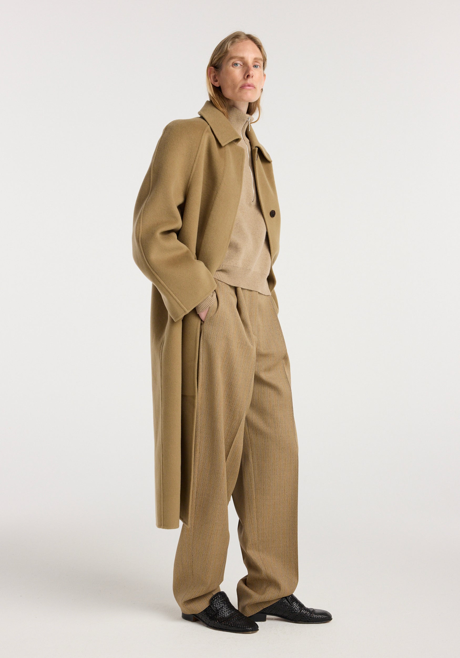 Woman wearing a camel double-faced wool padded coat over a beige turtleneck and matching wide-leg pants, paired with black textured shoes, standing against a plain background, Double-faced wool padded coat | camel.