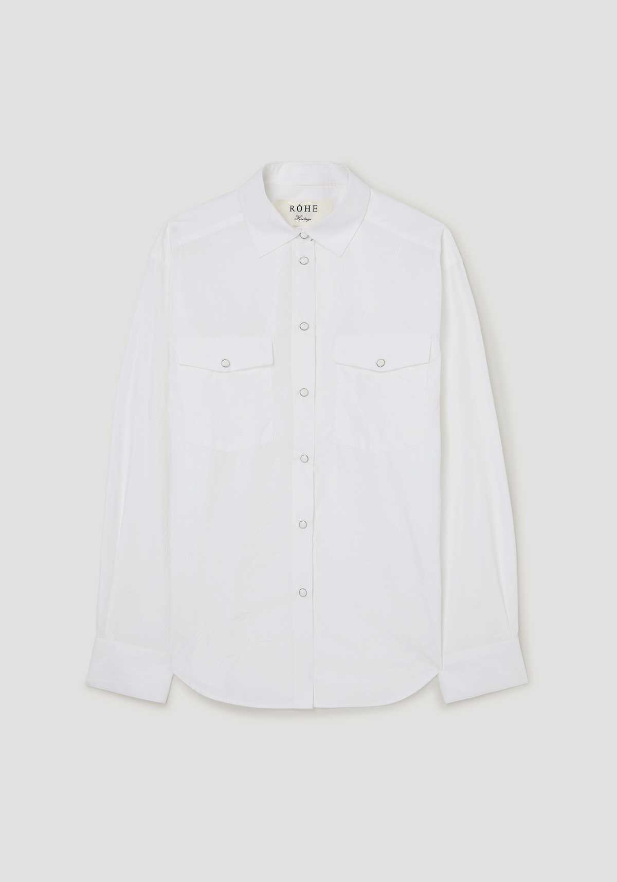 Western shirt | optic white shown flat with pointed collar long sleeves button front two chest pockets and curved hem