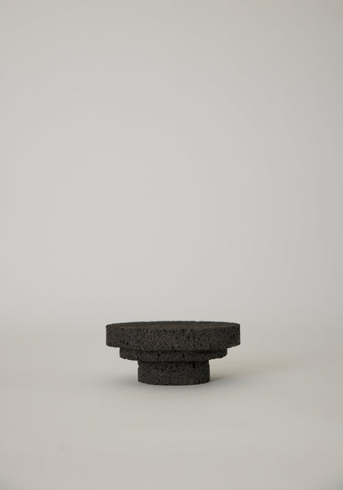 Elevated Sculptural Tray crafted from porous lava stone, featuring three stacked discs, showcasing a unique, handcrafted design by Dutch artist Louis Crombag.