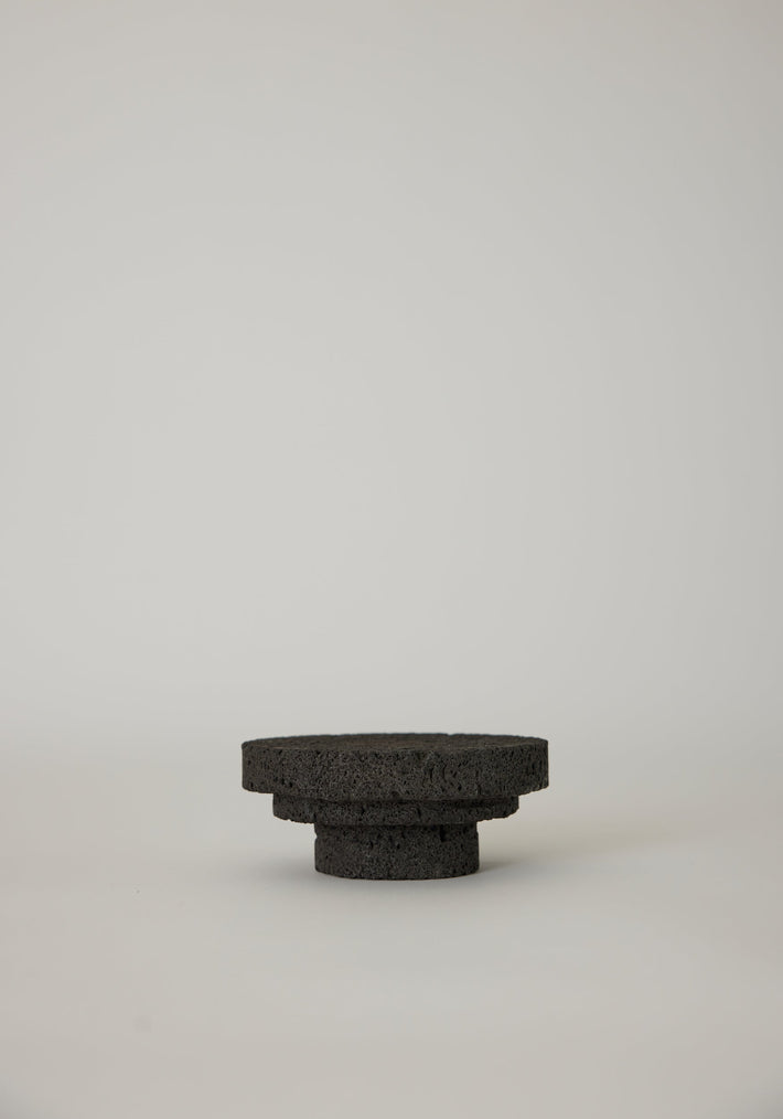 Elevated Sculptural Tray crafted from porous lava stone, featuring three stacked discs, showcasing a unique, handcrafted design by Dutch artist Louis Crombag.