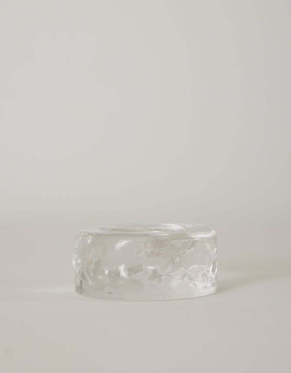 Presse-papier & holder: A translucent, low-profile glass cylinder with a rippled finish, resembling a minimalistic paperweight, handcrafted by Szkło Studio.