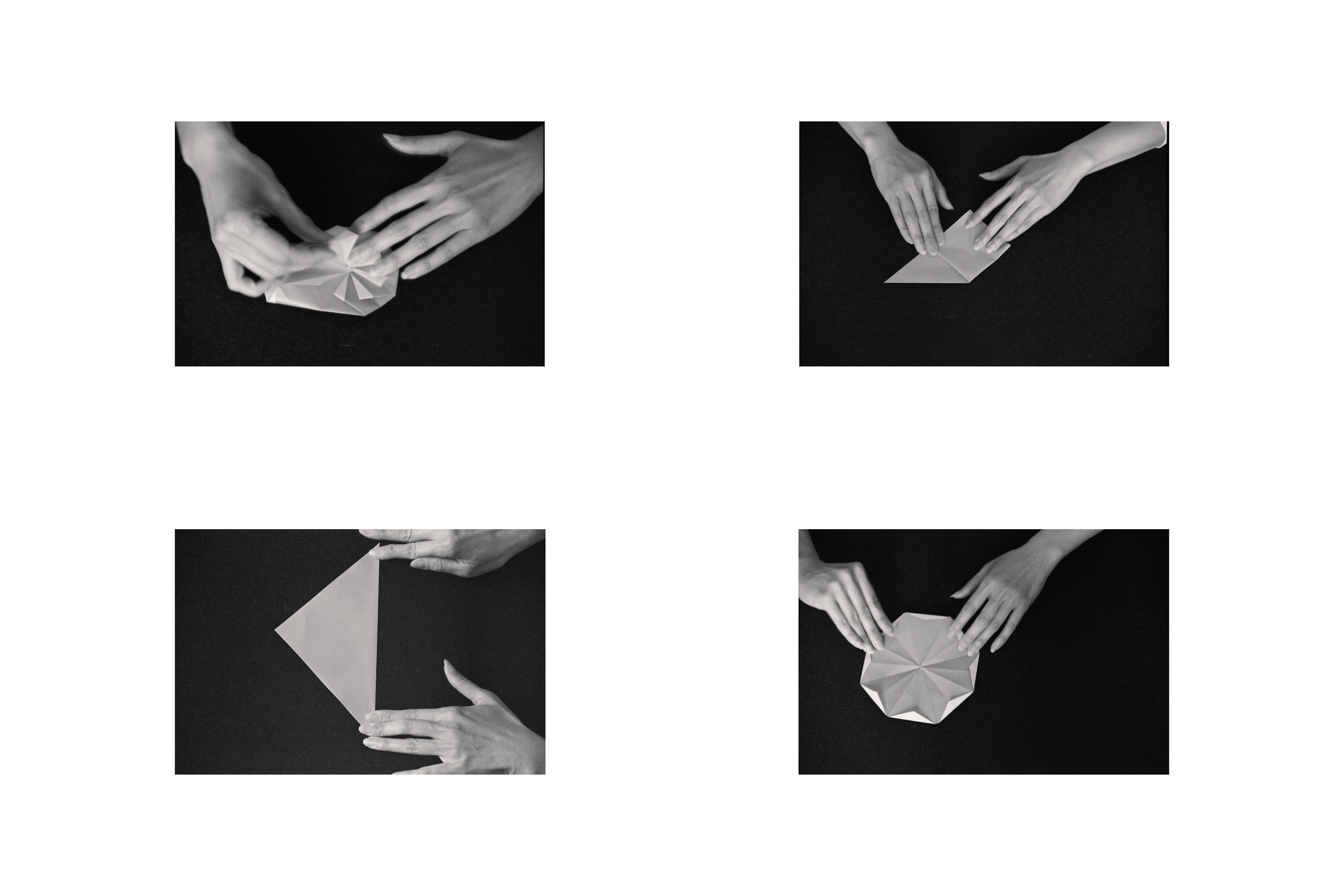 Black and white sequence of hands folding paper