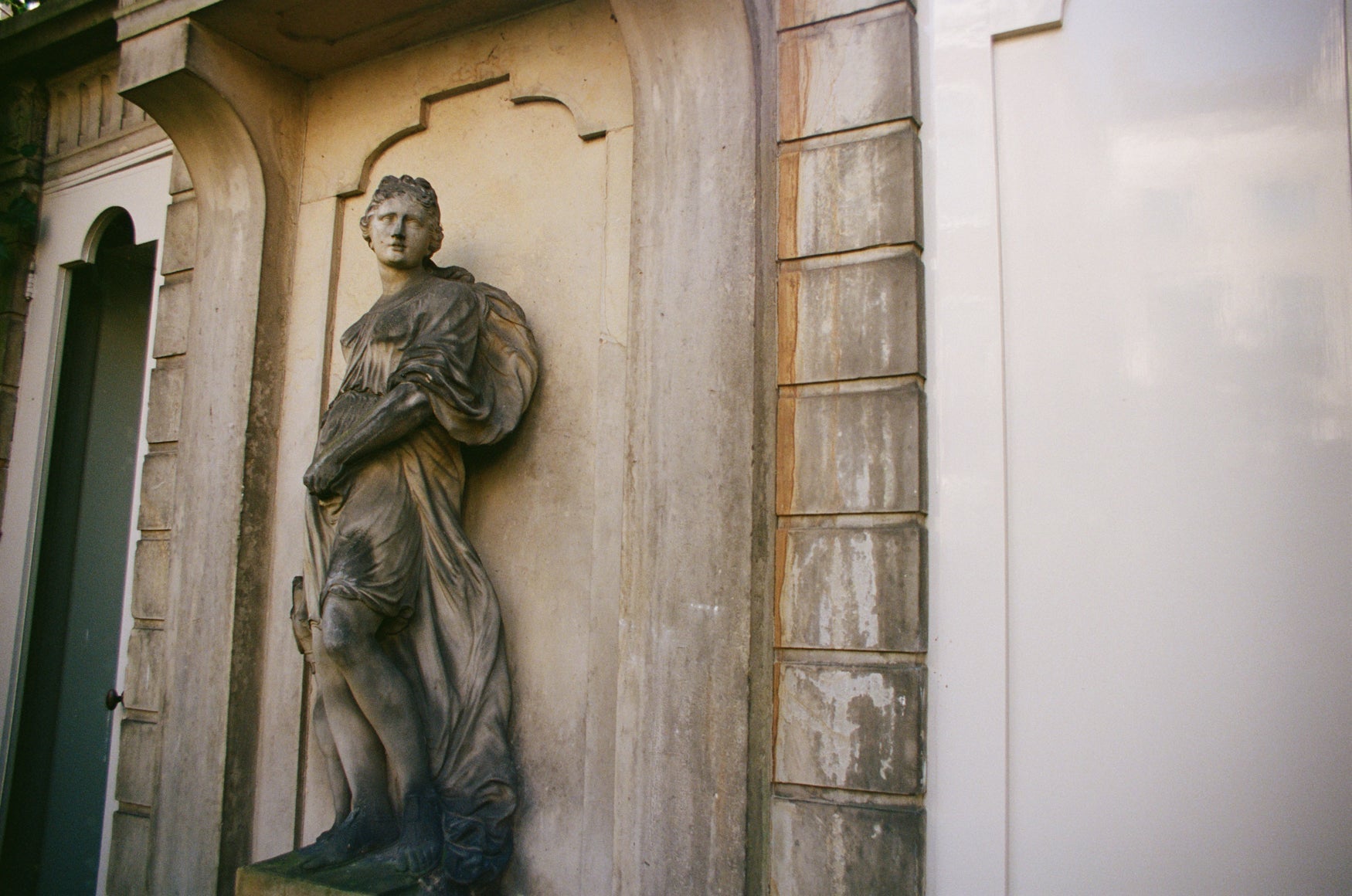 Statue of a person on a building facade