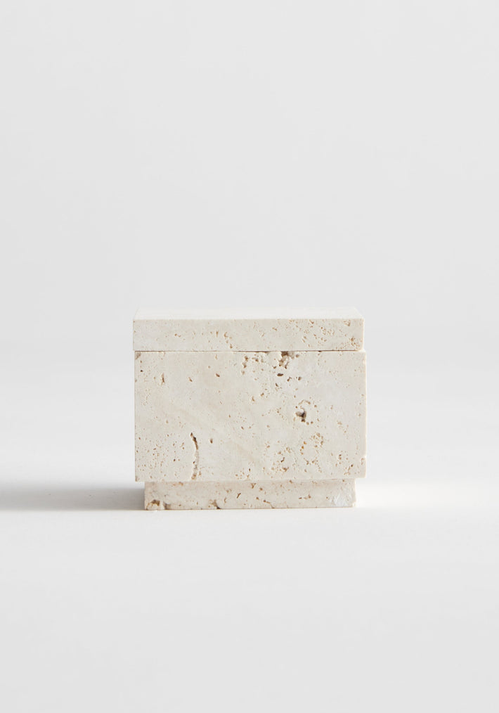 Tealight box | travertine: A small, rectangular travertine box with a lid, handcrafted by Louis Crombag. Suitable for tealights, made from natural, leftover stone.