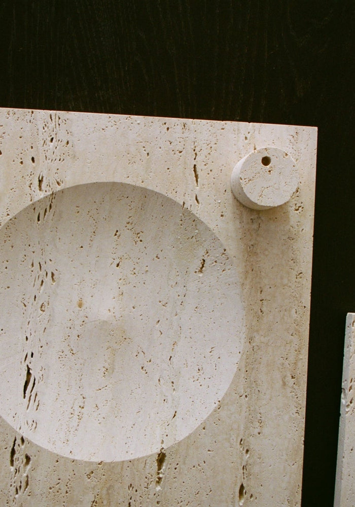 Small tray | travertine: Two light-beige travertine slabs feature a round, carved indent and a small circular relief, showcasing minimalistic, handcrafted design by Louis Crombag.