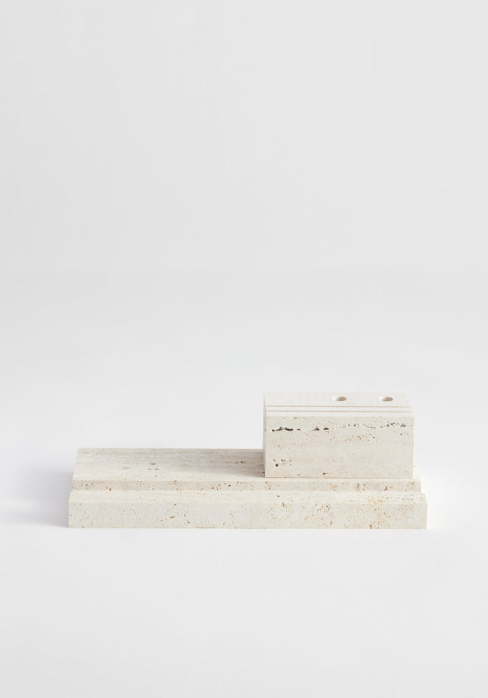 Desk organizer | travertine: Two-piece set with a rectangular base and smaller block, handcrafted by Louis Crombag from leftover Italian travertine, featuring pen holders.
