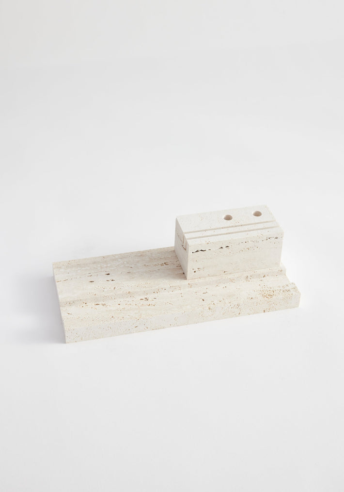 Desk organizer | travertine: Two-piece travertine set with a flat slab and smaller block featuring drilled holes, designed by Louis Crombag for organizing pens and paperwork.