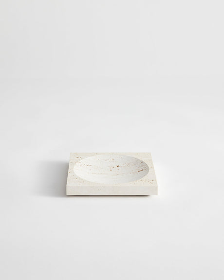Small tray | travertine: Square stone tray with a round indent, handcrafted from leftover travertine by Dutch artist Louis Crombag, showcasing minimalist design.