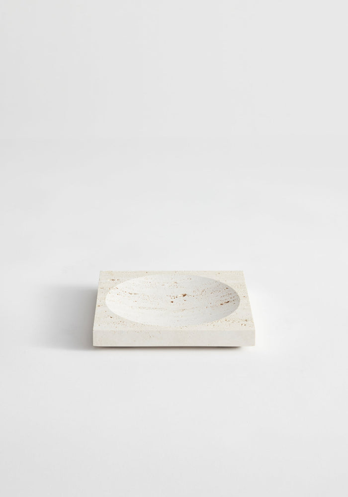 Small tray | travertine: Square stone tray with a round indent, handcrafted from leftover travertine by Dutch artist Louis Crombag, showcasing minimalist design.