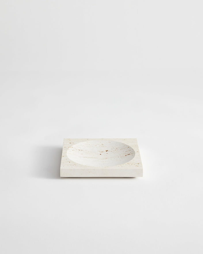 Small tray | travertine: Square stone tray with a round indent, handcrafted from leftover travertine by Dutch artist Louis Crombag, showcasing minimalist design.