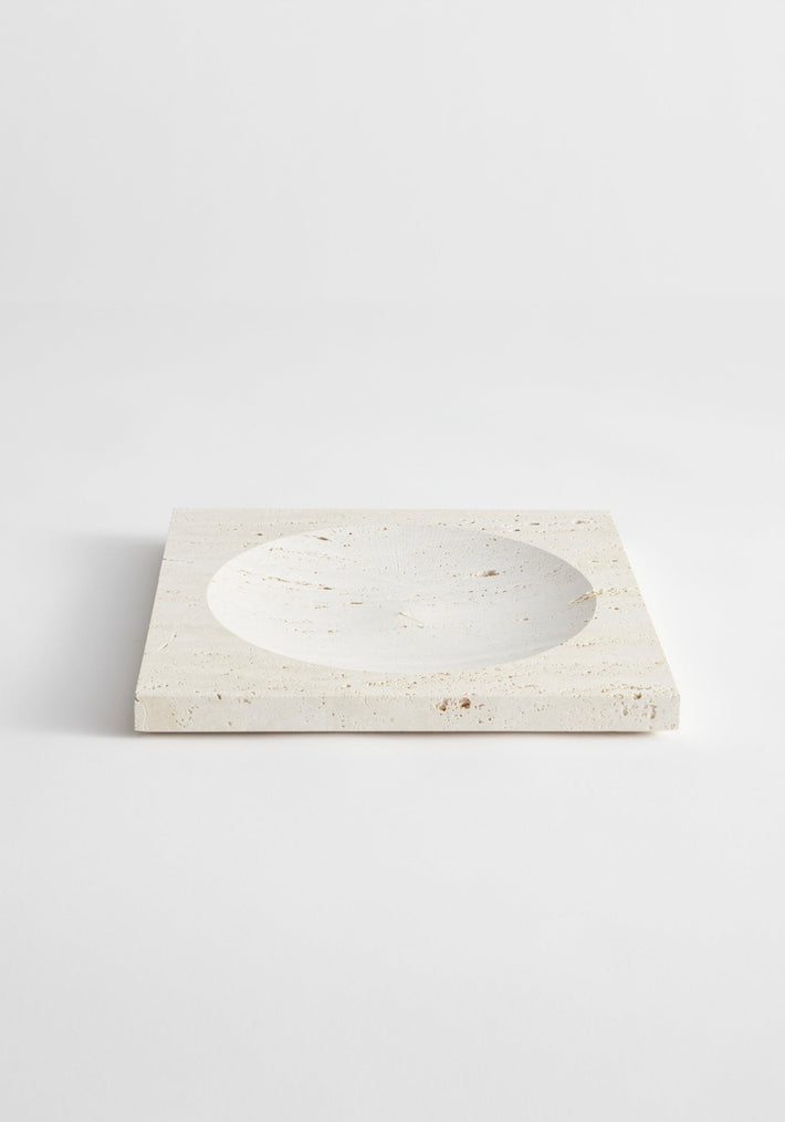 Medium tray | travertine: A handcrafted, square travertine tray with a central round indent, measuring 26cm x 26cm, made by Louis Crombag in the Netherlands.
